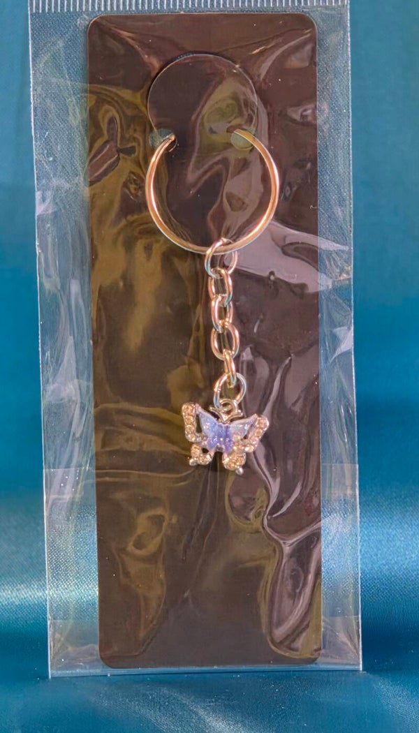 Schmetterling in hellblau/dunkelblau mit Strasssteinen