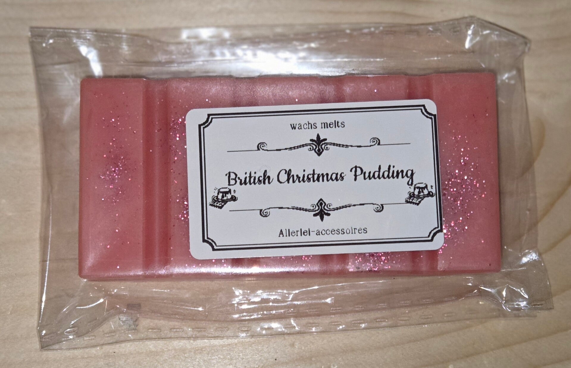 Wachs melts British Christmas Pudding