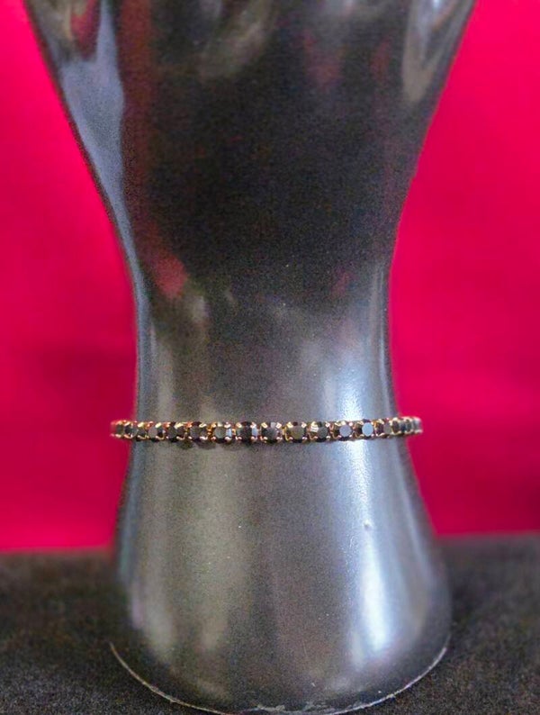 Armband mit schwarzen Steinen - gold - Titan Stahl