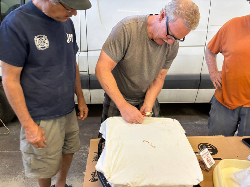 Russell, Brad, and Wayne working on covering the front seats of the Raffle Bus 35. Arizona Bus Cllub