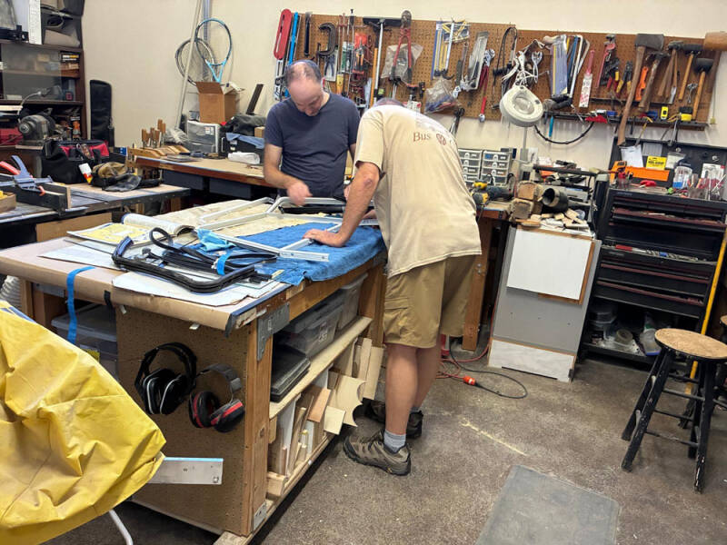 Brian and David working on the sliding windows on the front doors of the Raffle Bus 35. Arizona Bus Club