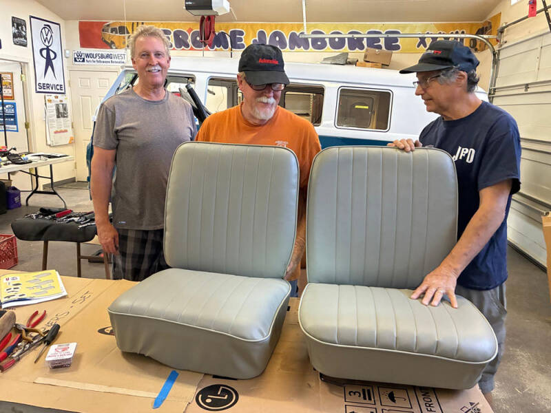 Brad, Wayne, and Russell working on covering the front seats of the Raffle Bus 35. Arizona Bus Cllub