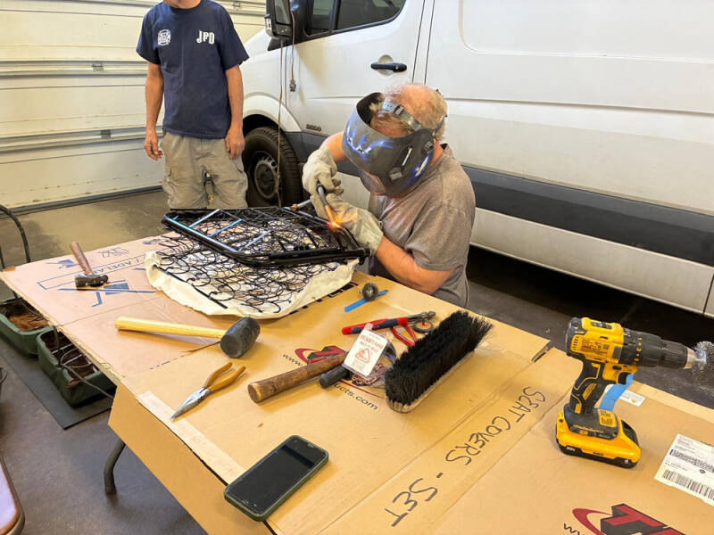 Russell, Brad, and Wayne working on covering the front seats of the Raffle Bus 35. Arizona Bus Cllub