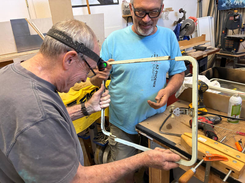 John and Mike working on the window frames.