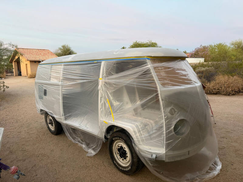 Wayne painted the top of the Raffle Bus.