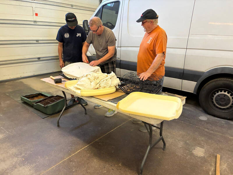 Russell, Brad, and Wayne working on covering the front seats of the Raffle Bus 35. Arizona Bus Cllub
