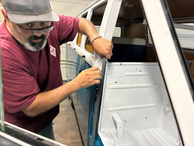 David Pedroza working on raffle bus doors.