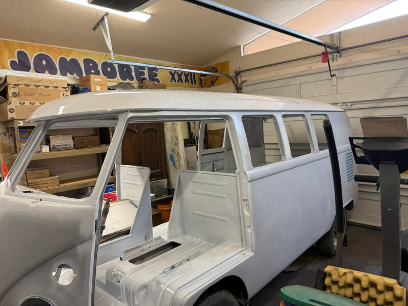 Wayne painted the top of the Raffle Bus.