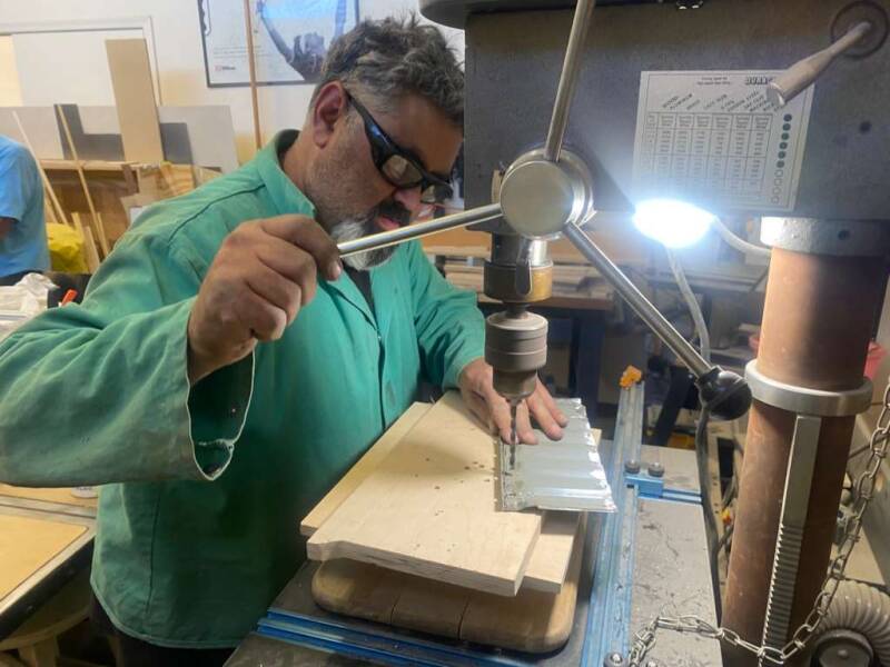 David working the drill press.