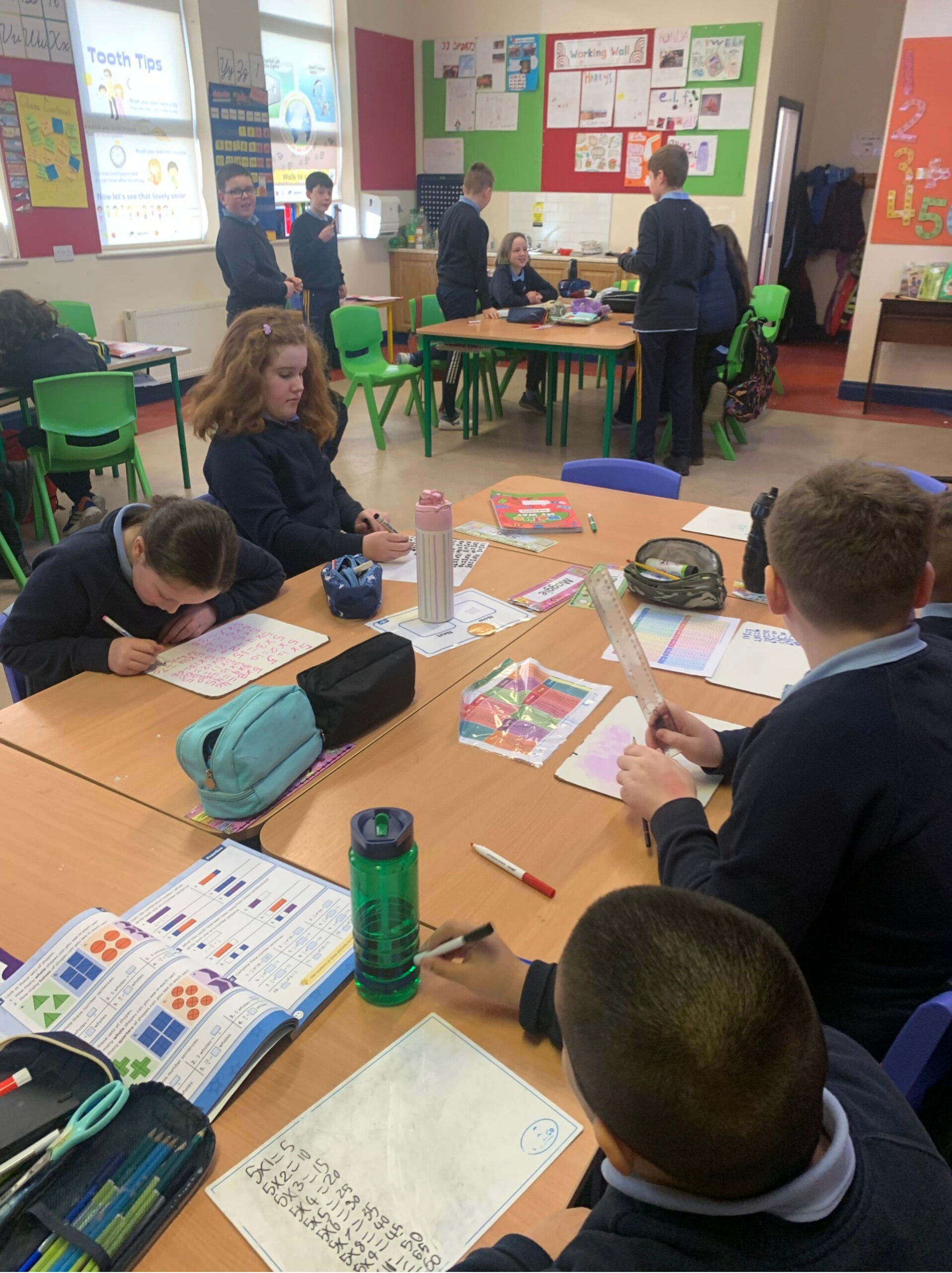Classroom of student are engaged in Maths activities in class.
