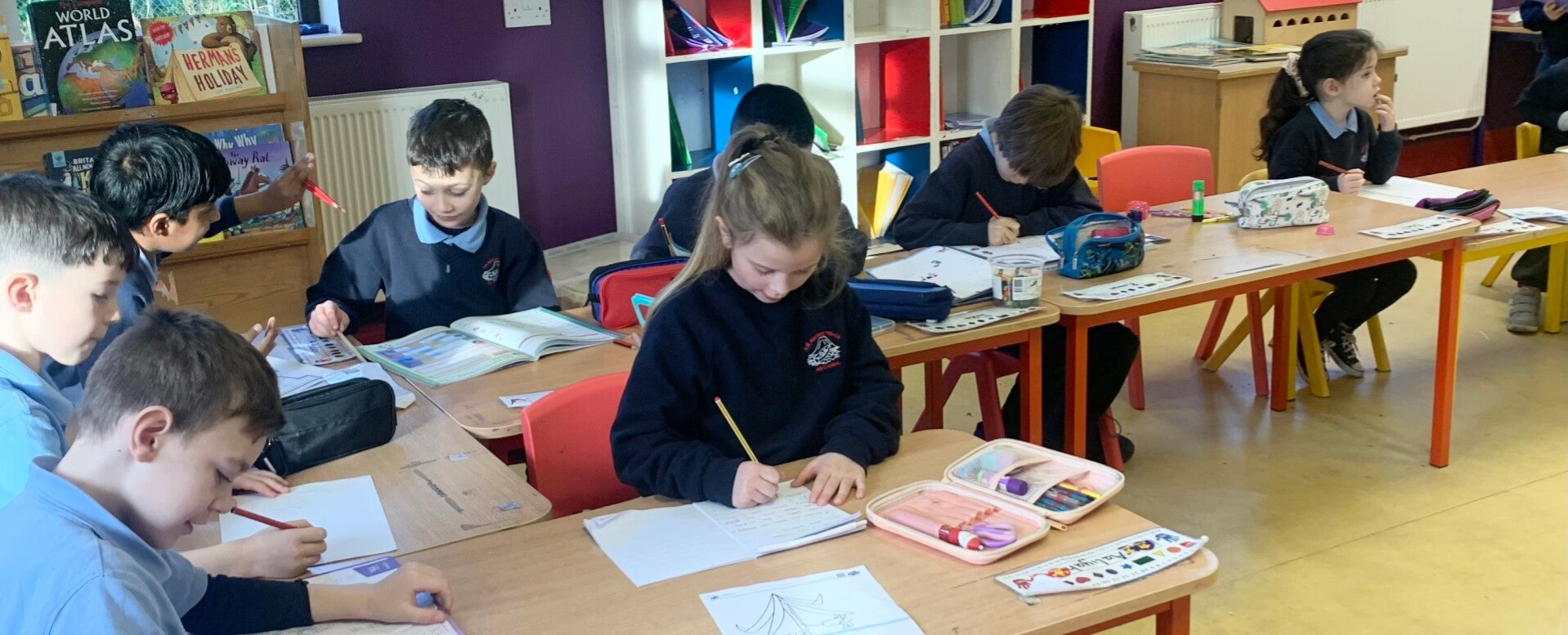 Eight students engaged in learning activities in class.