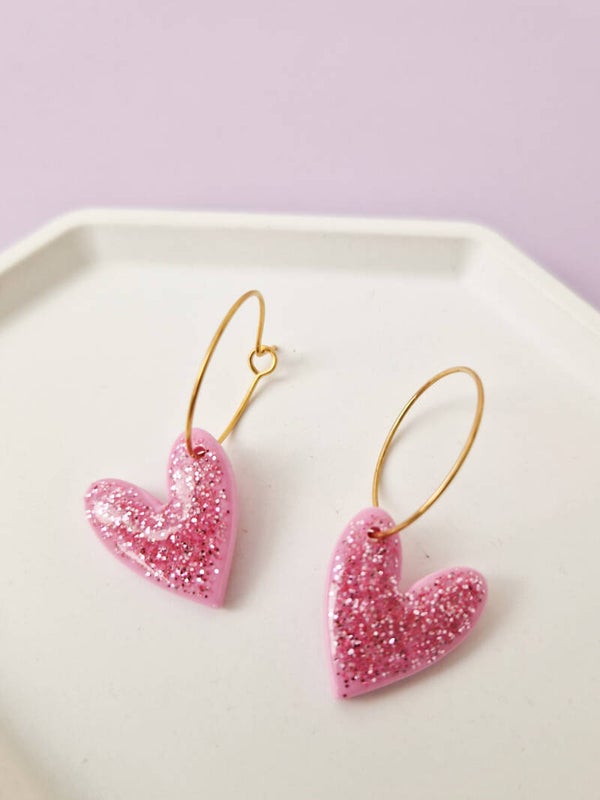 Roze glitter hartjes oorbellen
