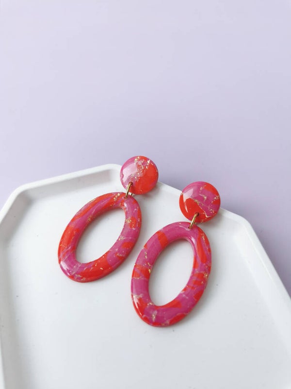 Rood/roze ovale oorbellen