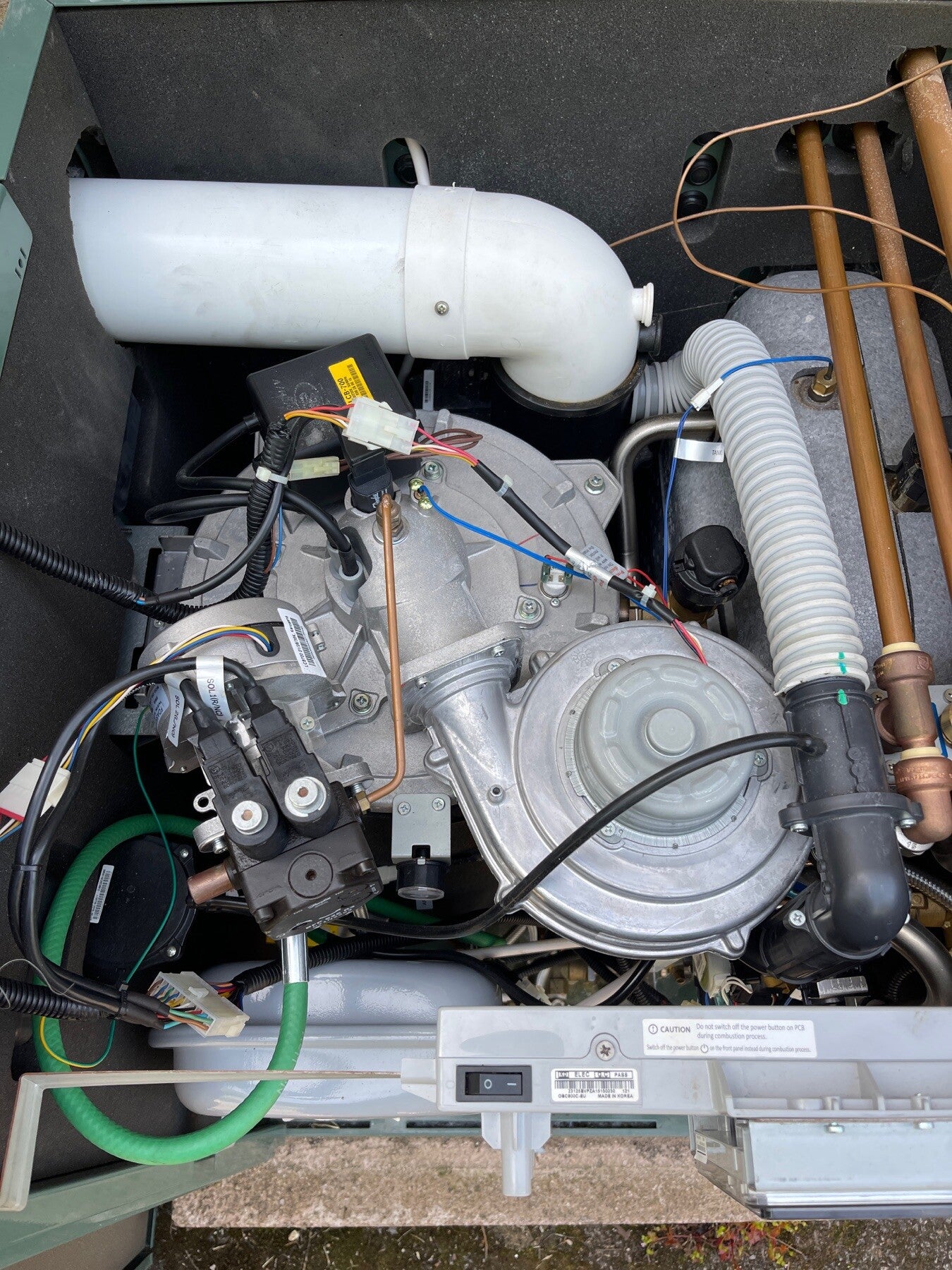 Internal burner and flue components checked during a Navien LCB700 service in Stroud