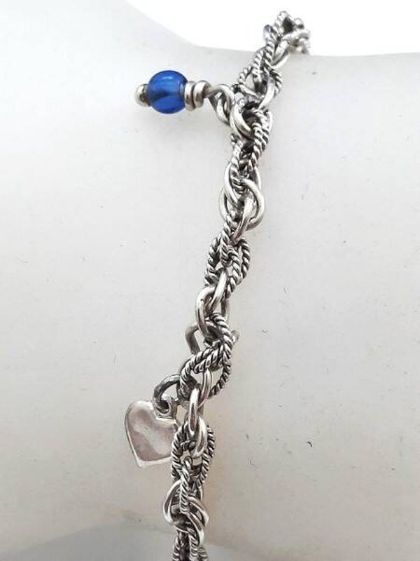 Prachtig zilveren armbandje met vier bedels, 925