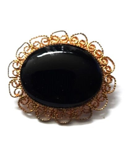 Prachtige vintage goudkleurige filigraan broche. Grote zwarte Cabochon