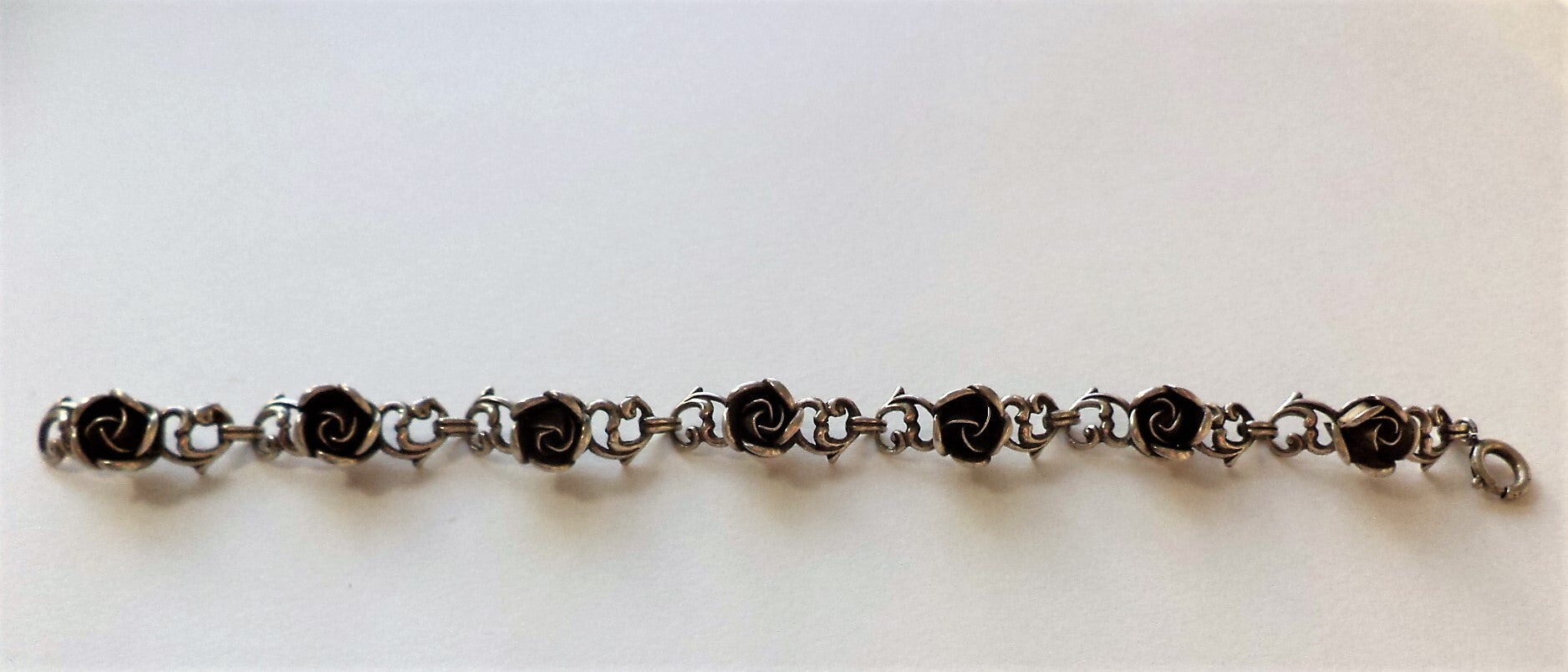 Prachtige zilveren armband met 7 verfijnde rozen - Theodor Klotz Teka