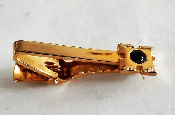 Triangle dasklem dasclip, verguld, met donker steentje