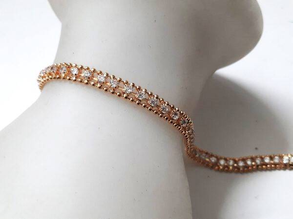 Schitterende goudkleurige Tennisarmband met strass (7902)