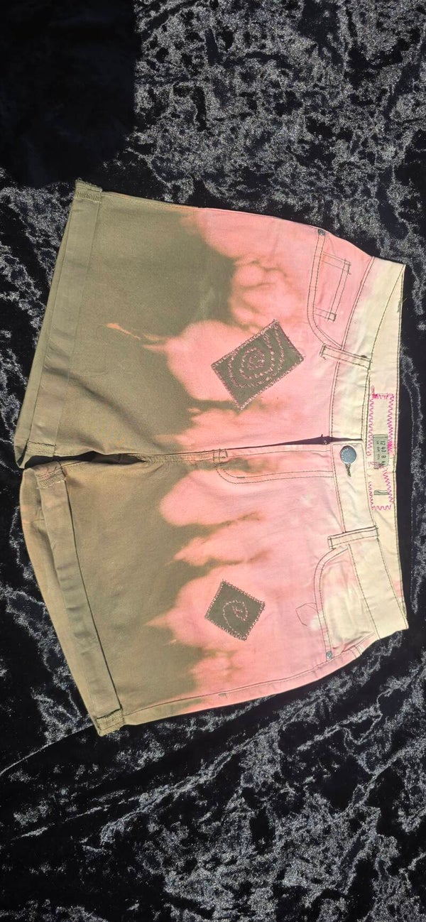 Tie-dye patched shorts in pink and khaki.