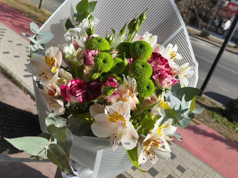 vibrant pink roses and seasonal white flowers ordered for a loved one who ended up in a hospital in Rustavi