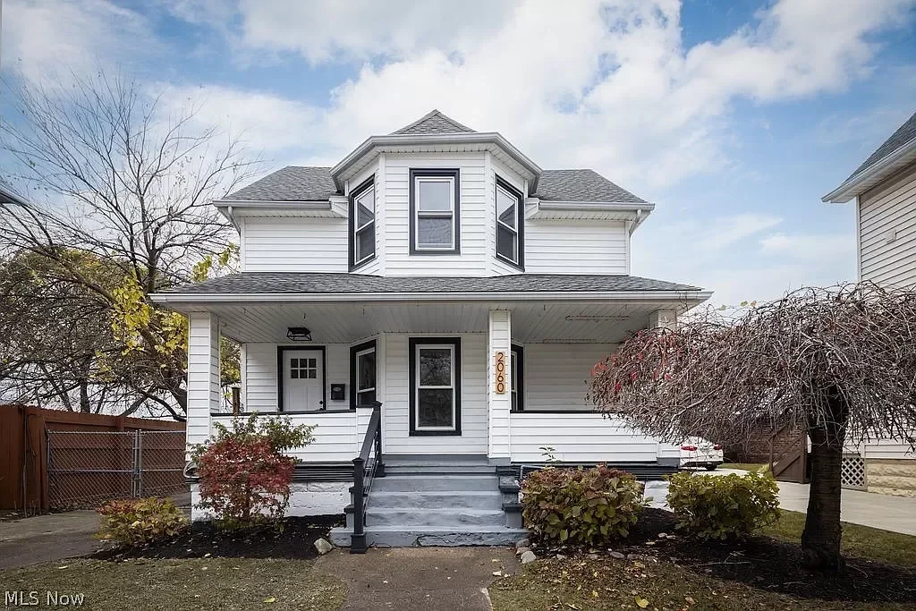 Complete exterior renovation featuring vinyl siding, new windows, and updated front porch