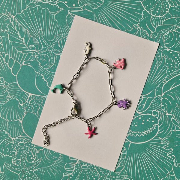 Schakelarmbandje kind zilverkleurig RVS - emaillen bedeltjes thema 'sea' (pastel)