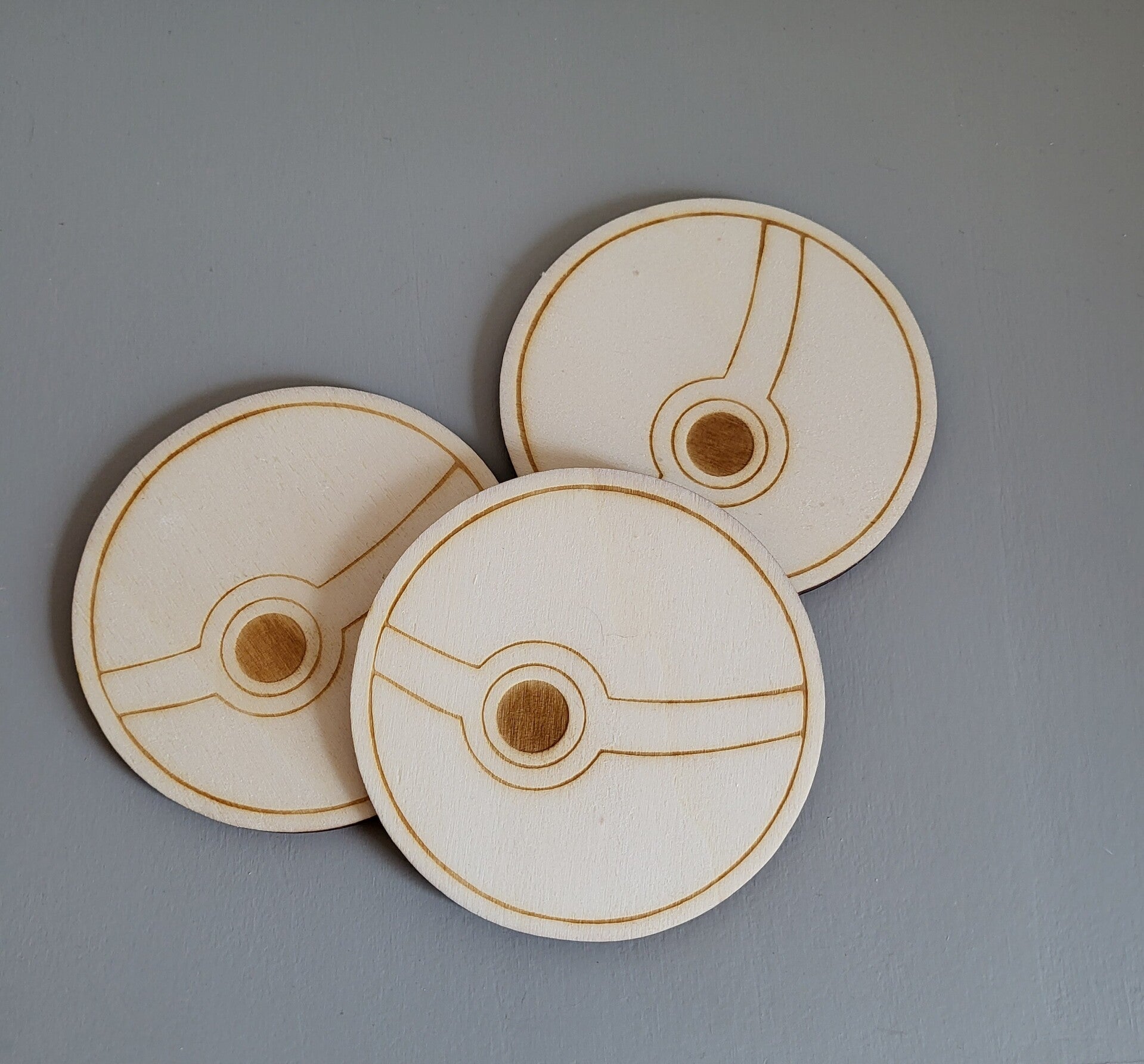 Houten onderzetters - Pokéball