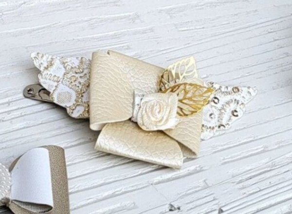 Strik goud vleugels roosje