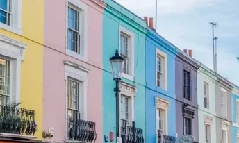 Notting Hill's iconic pastel houses. Flossies Fine Foods provides milkman and wholesale dairy service to Central London cafes, bakeries, and restaurants.