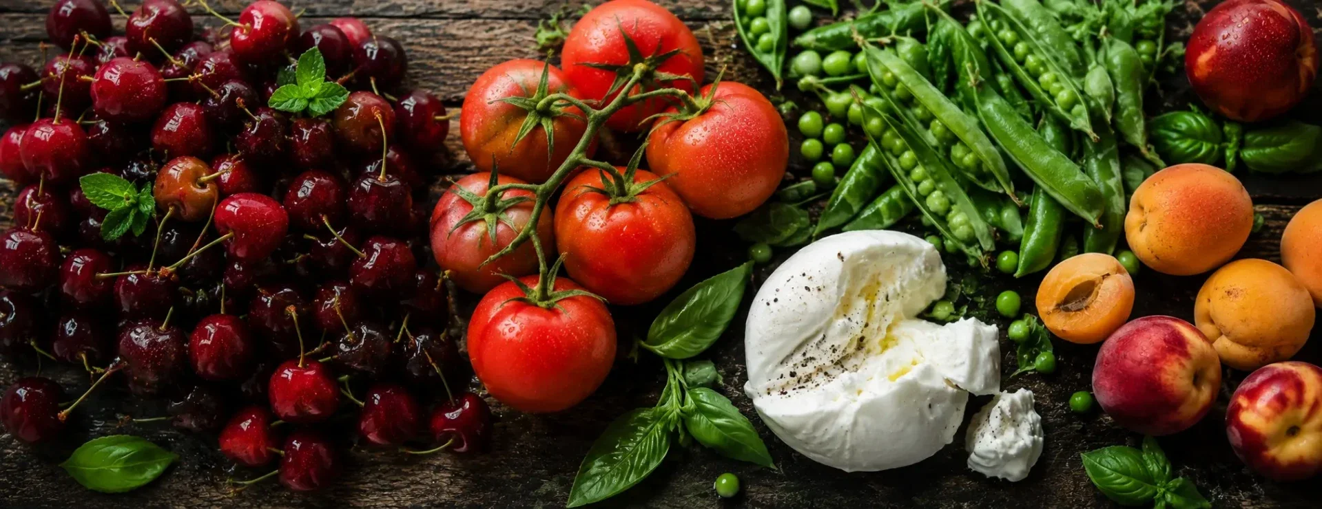 Fresh June seasonal produce and dairy from New Covent Garden Market including British cherries, heritage tomatoes, burrata and English apricots, sourced by Flossies Fine Foods for London restaurants and cafes.
