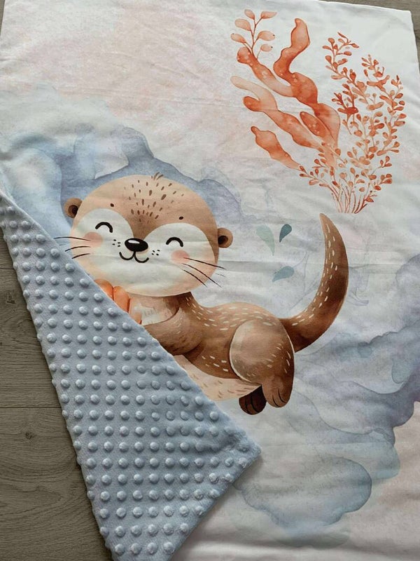 Couverture loutre 🦦🩵