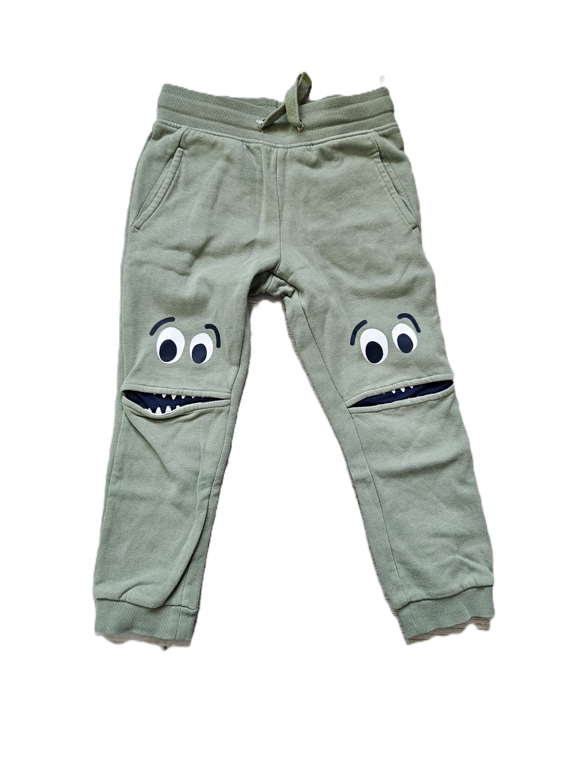 C&A Lichtgroene broek met gezichtjes