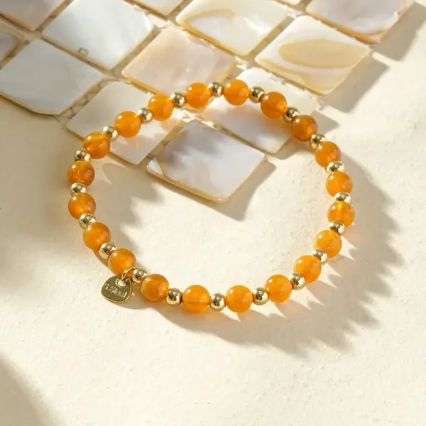 W129 - Bracelet élastique en acier inoxydable et acrylique organique - Orange