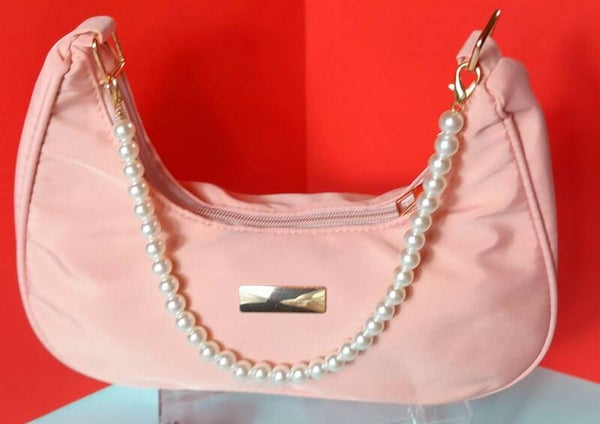 Sac rose en tissus avec ance perlée