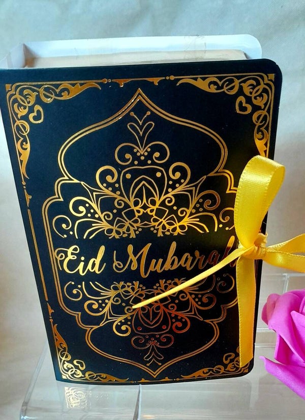 Livre noir et or Eid Mubarak avec boucles d'oreilles