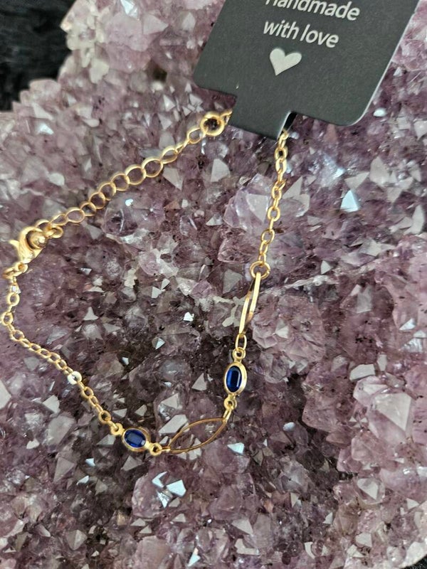 gouden armband blauwe steentjes