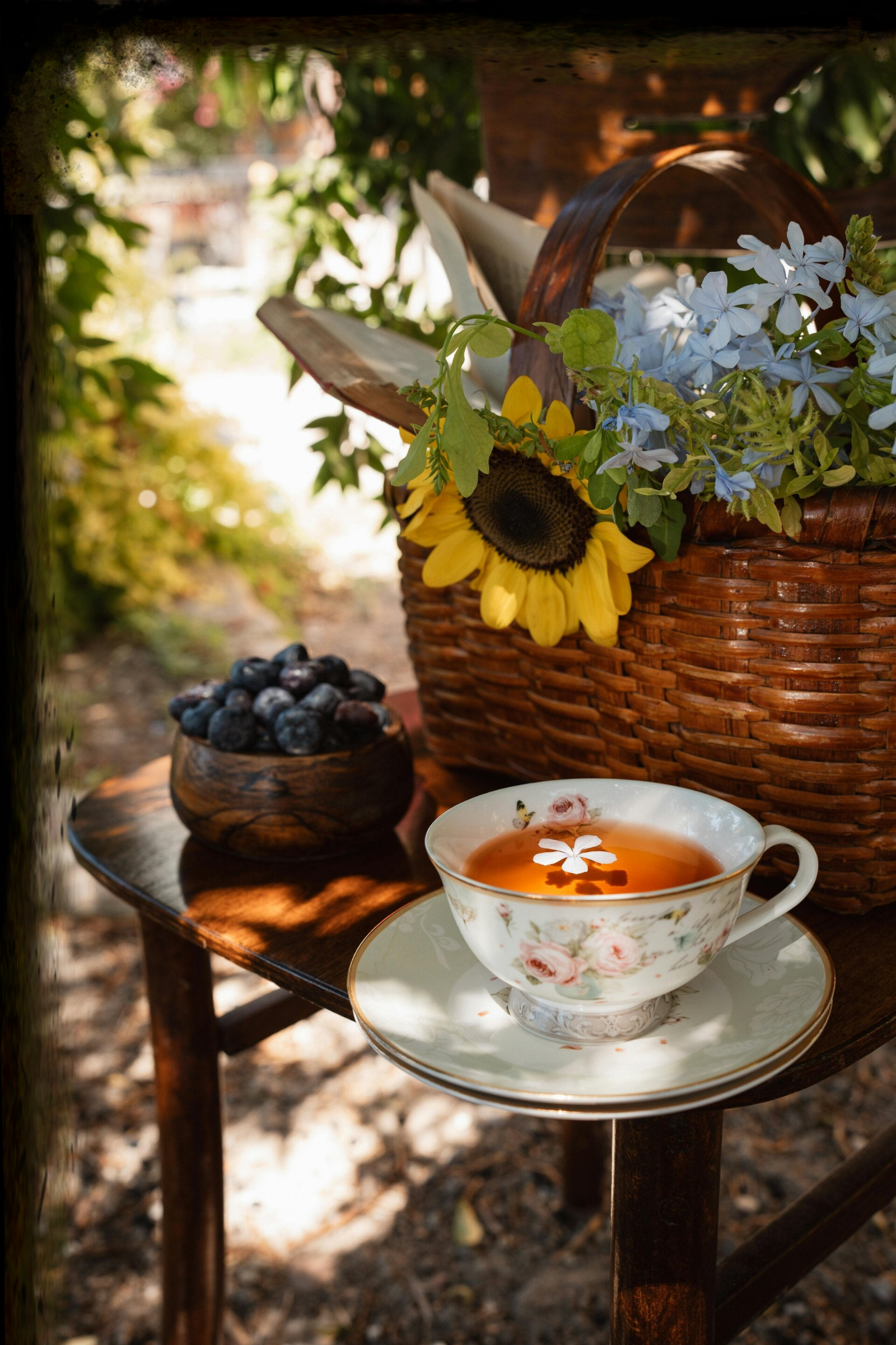 detox tea in the sun by a basket of flowers 