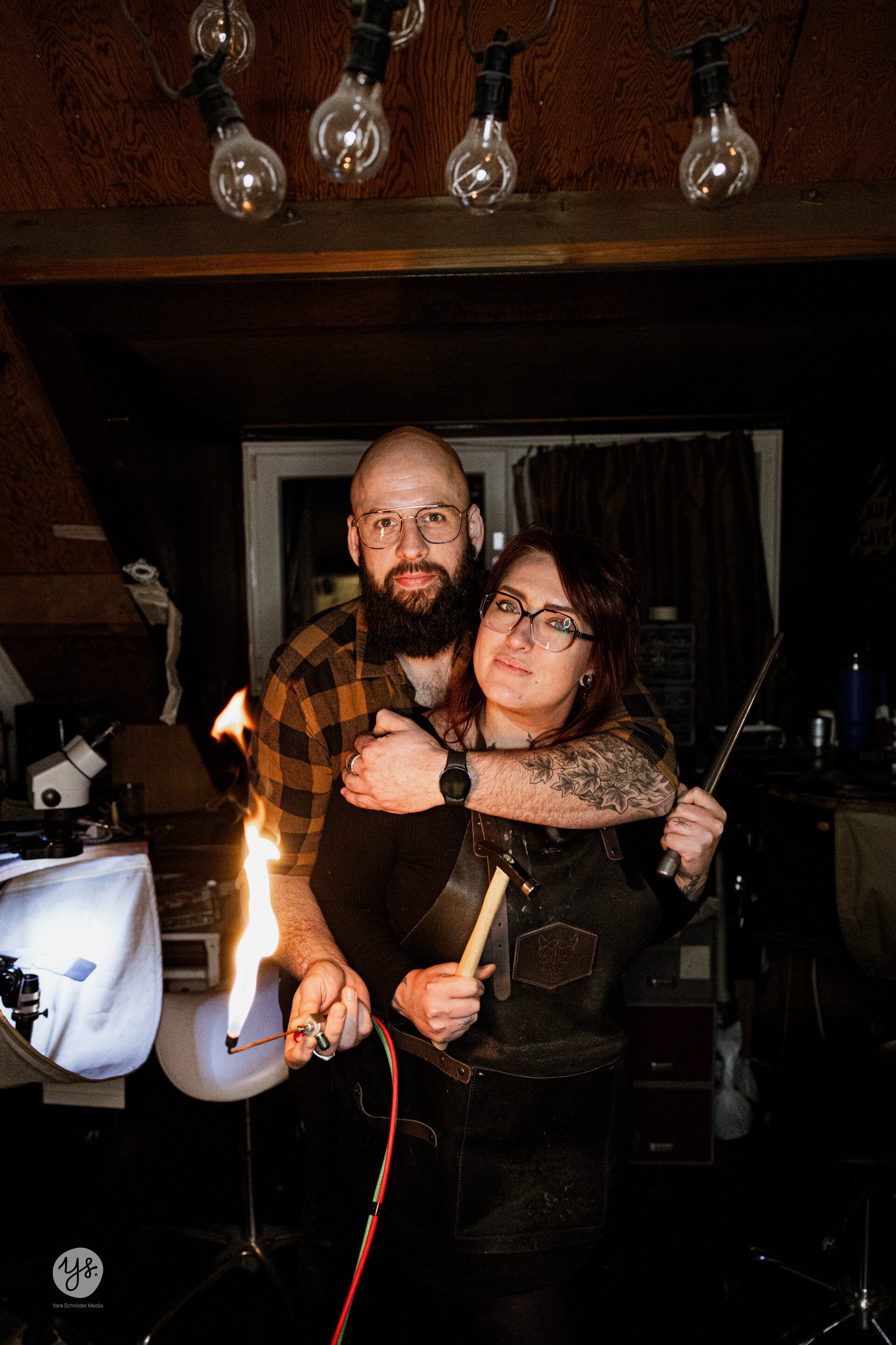 Goldsmiths working in their atelier using a little torch