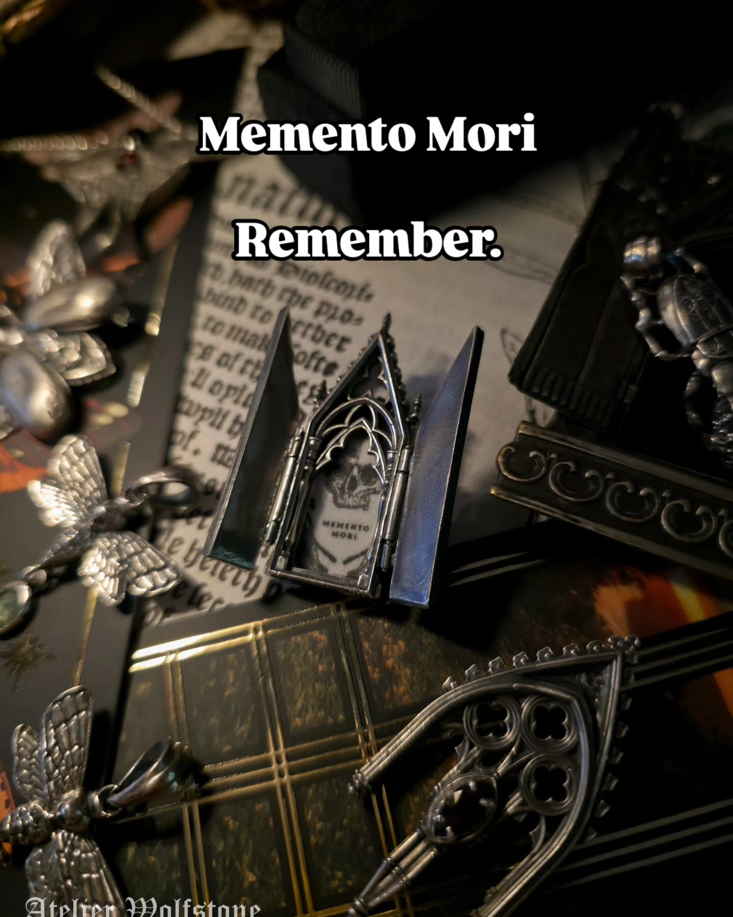 Open gothic silver memento mori locket with a skull inside, styled with a moth pendant, gothic window frame and an antique book