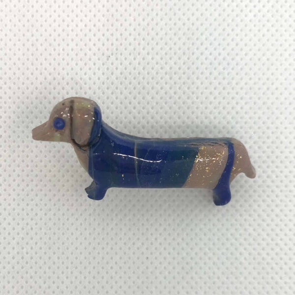 Broche Tekkel
