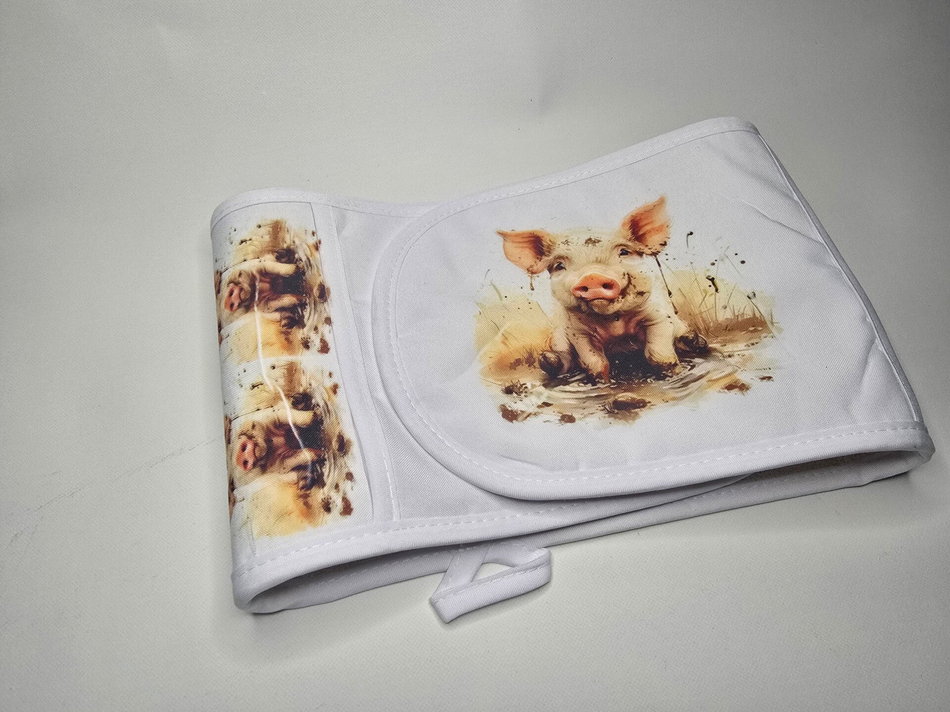 Country pig in mud oven gloves