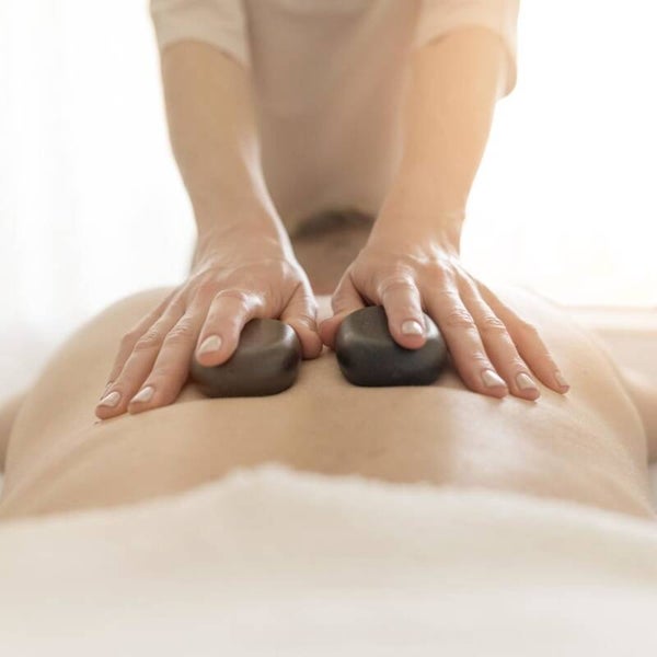 Bon cadeau Massage Aux pierres chaudes 1h30