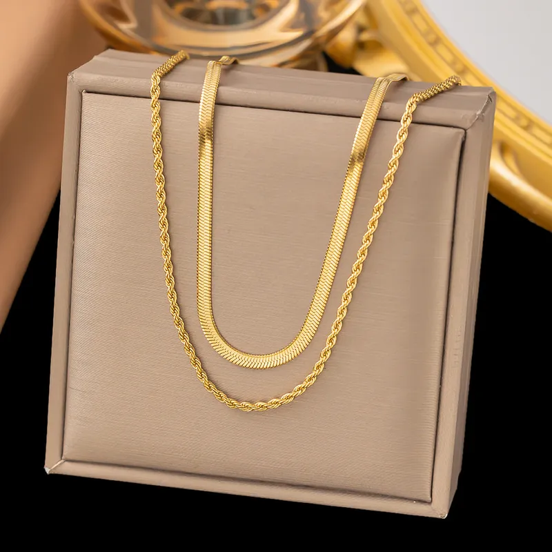 1621	Collar doble dorado-acero titanio