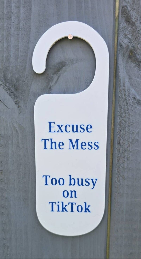 Excuse the mess, too busy on TikTok door hanger