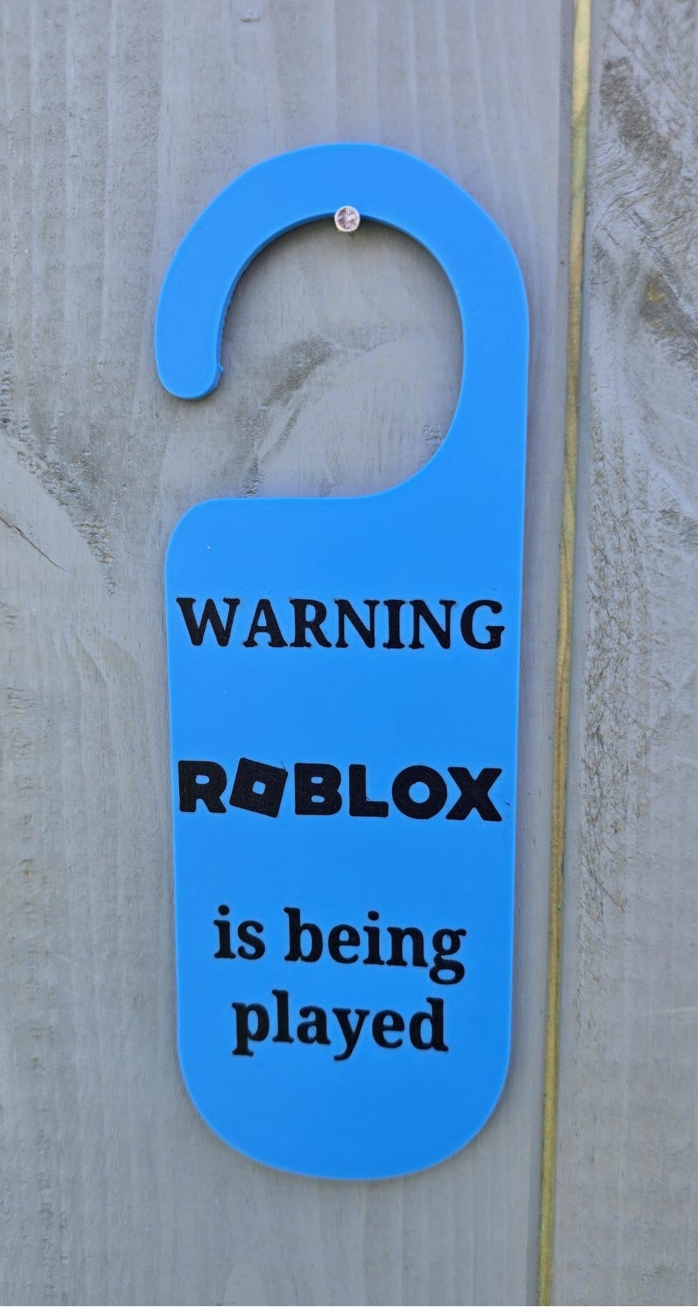 Warning.  Roblox is being played door hanger