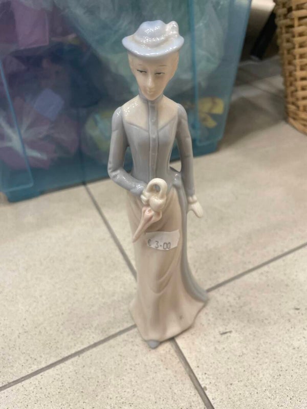 ceramic figurine of a Victorian lady - figurines*
