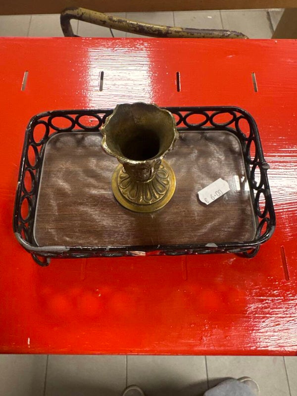 Ornate brass-toned miniature chalice resting inside a dark metal-wire-work tray - brass***