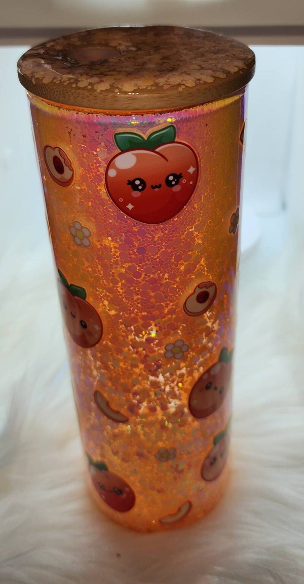 Peach snow globe tumbler with decorated lid