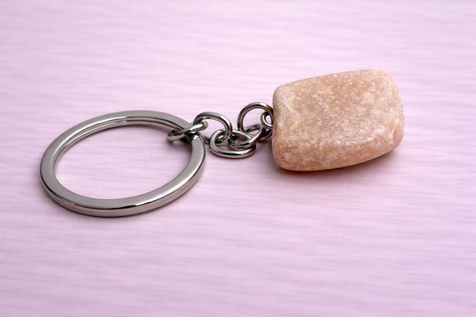 Oranje calciet sleutelhanger ruw